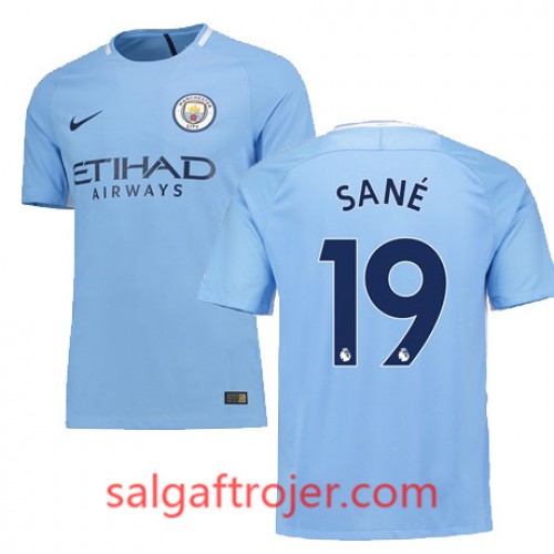 Manchester City Fodboldtrøjer SANE Hjemmebanesæt 2017/18 Kort ærmer Manchester City Fodboldtrøjer SANE Hjemmebanesæt 2017/18 Kort ærmer